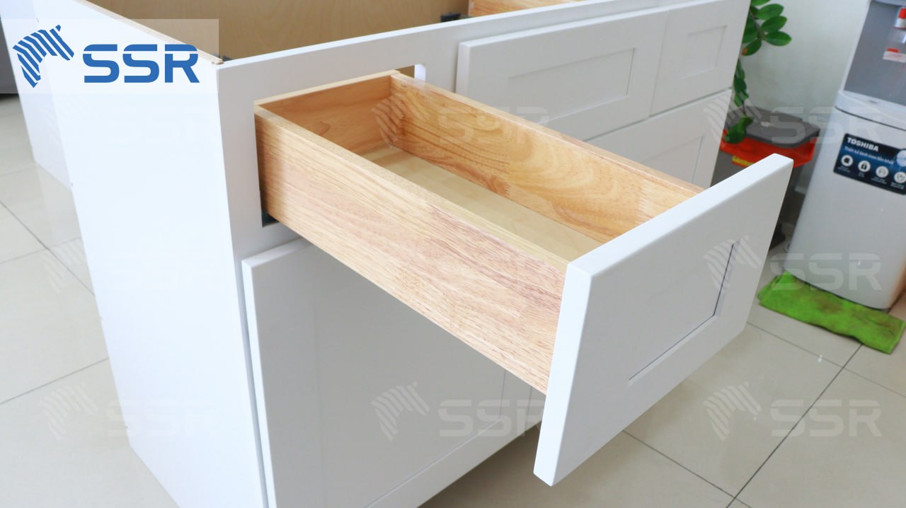 White kitchen cabinet with a solid wood drawer box