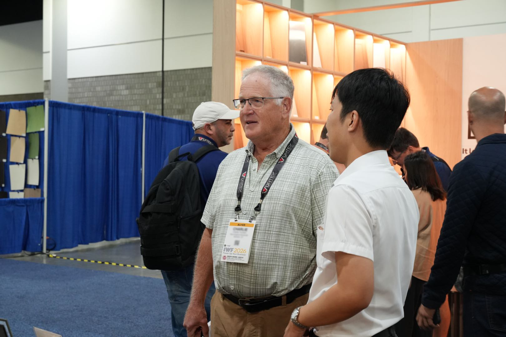 Customers discussing wood product specifications with SSR at IWF 2026