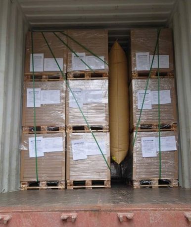Loading acacia wood products into export containers
