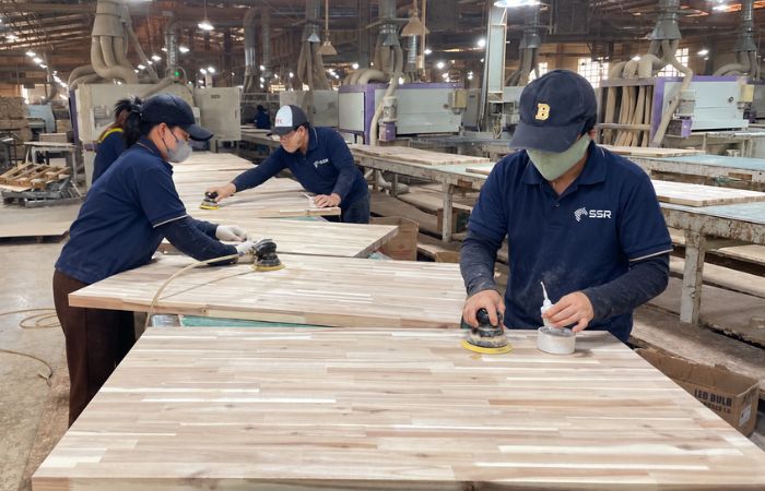 Final sanding of acacia wood panels